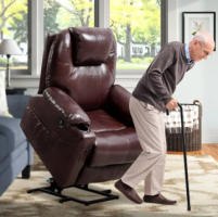 Elderly man using a can gets up from a lift chair.